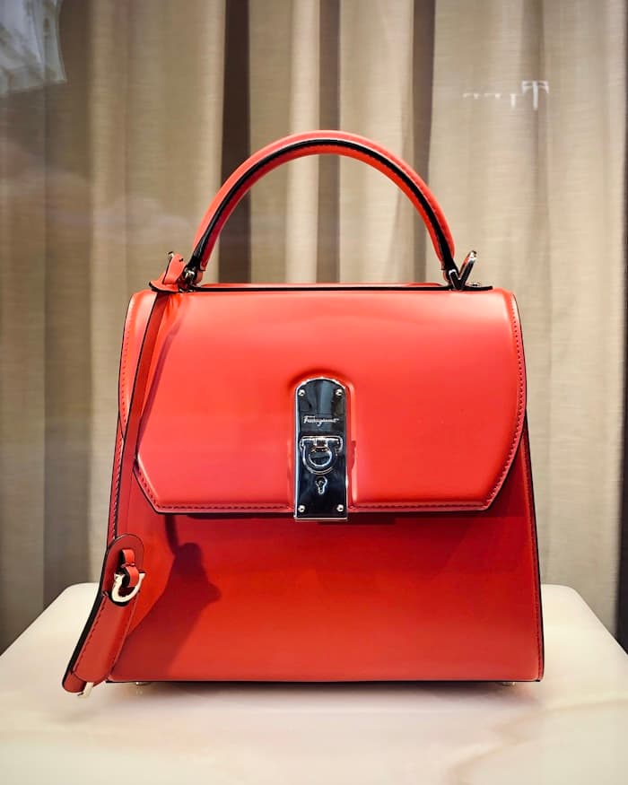 A coral structured leather handbag